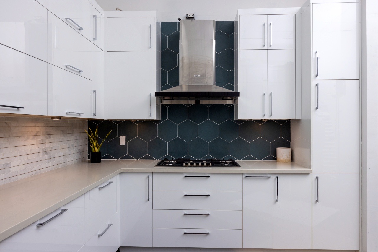 White kitchen with hex tile backsplash